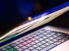 laptop-computer-with-halfopen-screen-dark-background-copy-space (1) (1)