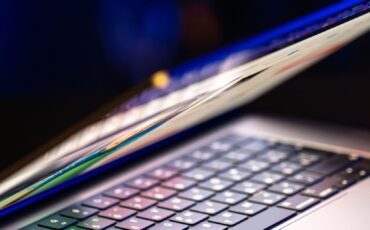 laptop-computer-with-halfopen-screen-dark-background-copy-space (1) (1)