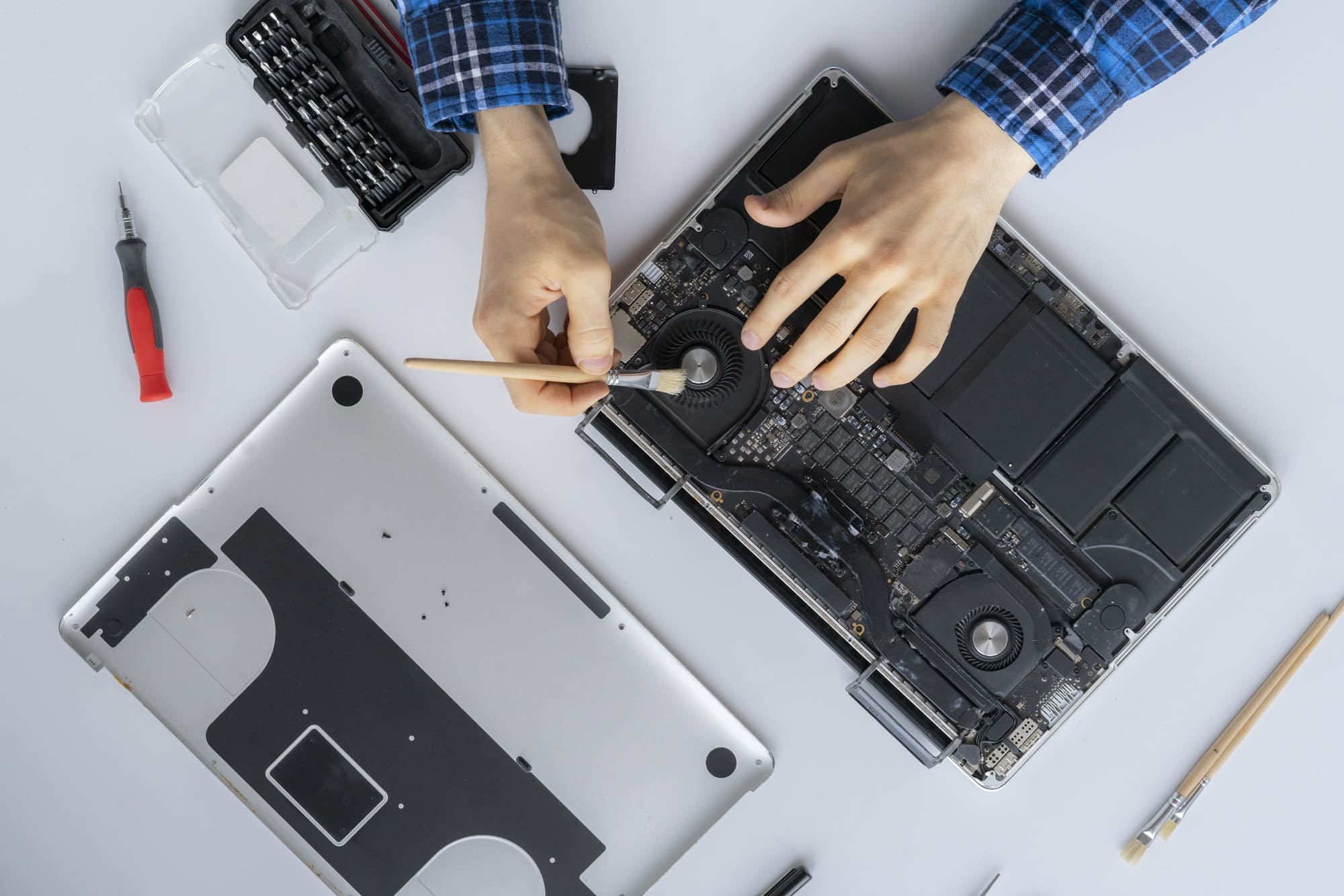 man-s-hands-working-computer-service-remove-dust-from-personal-laptop